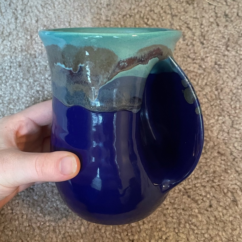 Handmade pottery coffee mug with a unique handle pocket for your handhold.